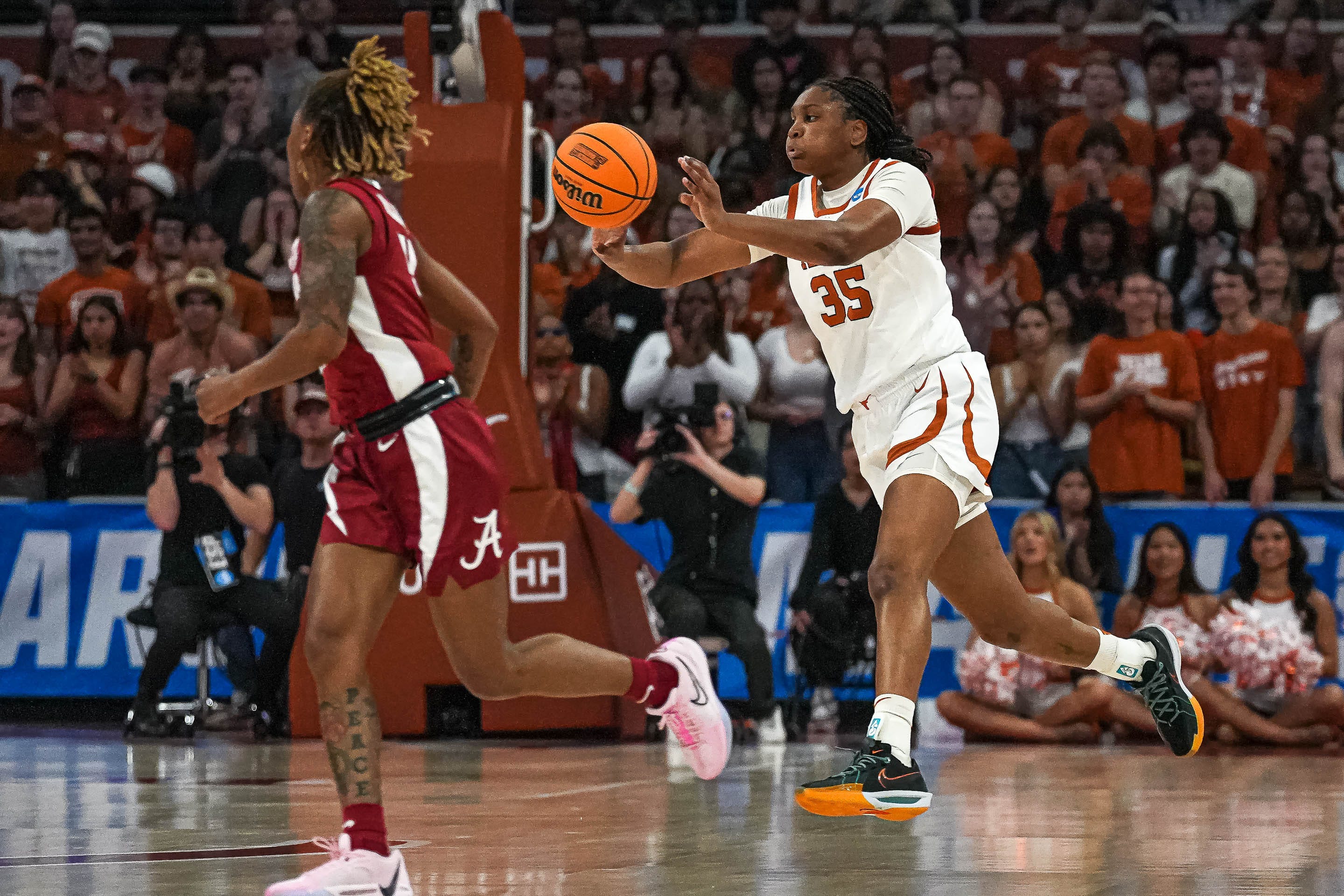 Texas Longhorns guard Madison Booker (35) passes the ball during the NCAA playoff game against Alabama at the Moody Center on Sunday, Mar. 23, 2024 in Austin.